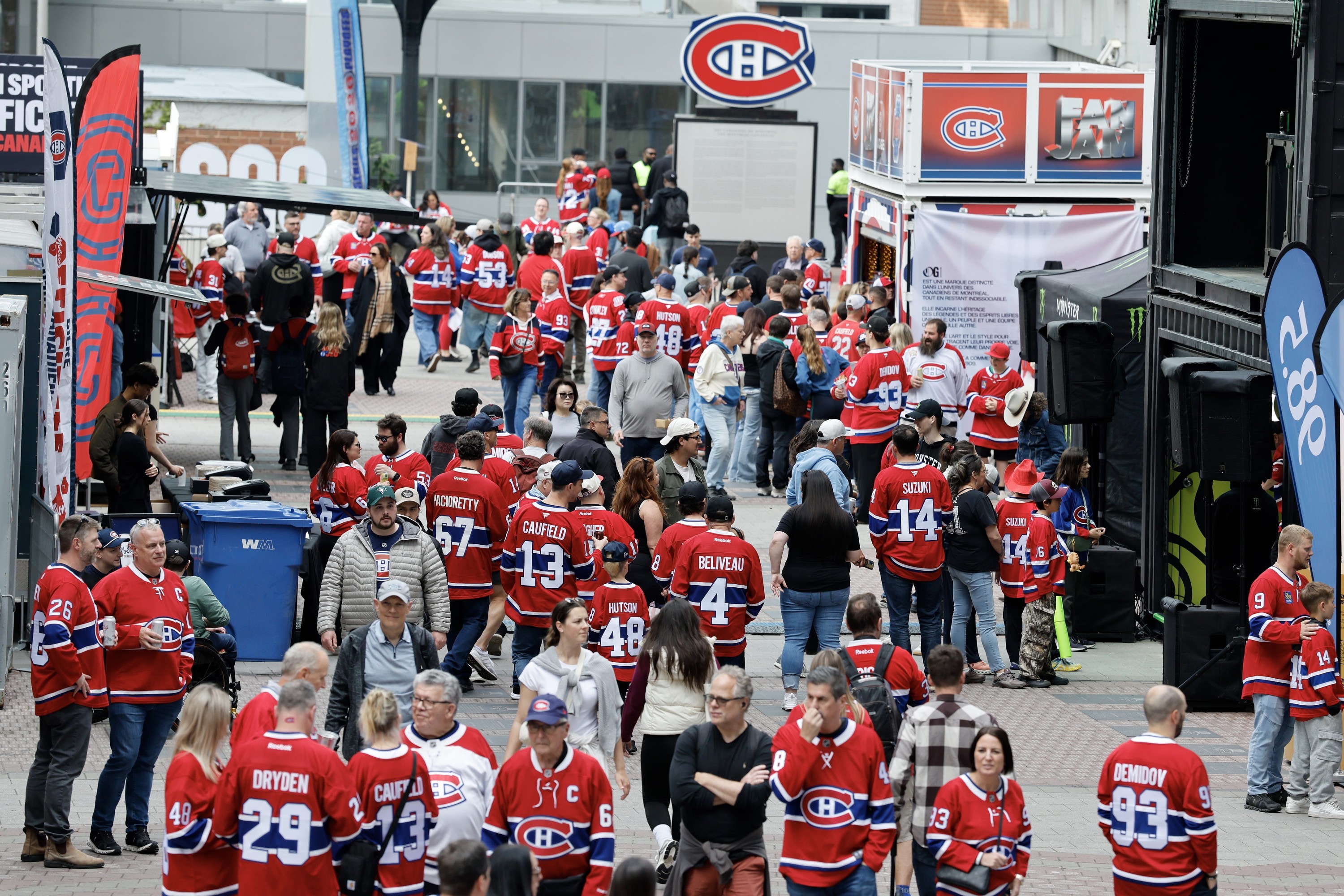 Crowd of people on the street wearing Canadiens jerseys