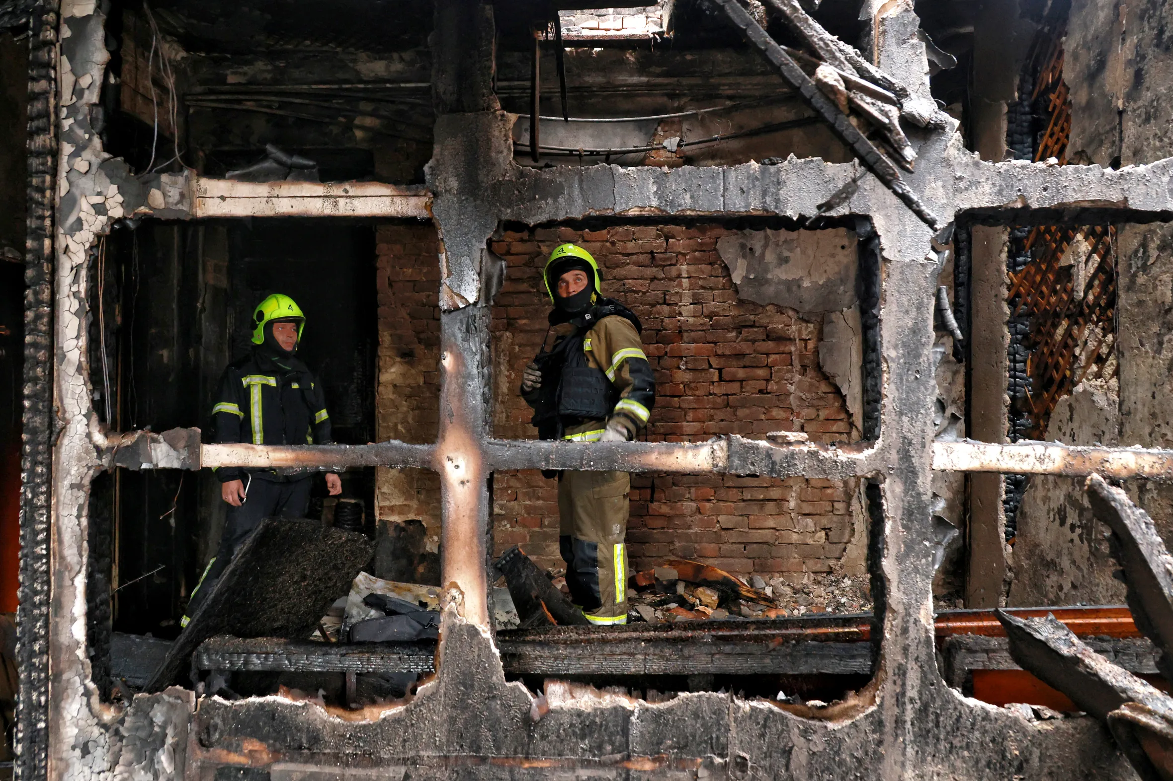 Firefighters survey the charred remains of a building destroyed by a Russian drone attack in Odesa, Ukraine.