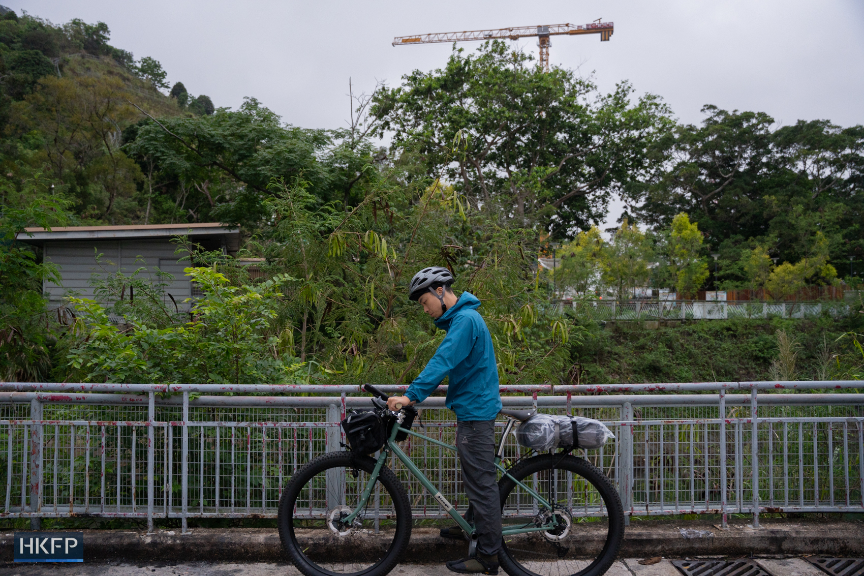 Fung testing his bike in Sha Tin district, 5 May 2026. Cycling is one of Fung's hobbies, he said it can relax him and feel nature without a camera. Photo: Kyle Lam/HKFP.