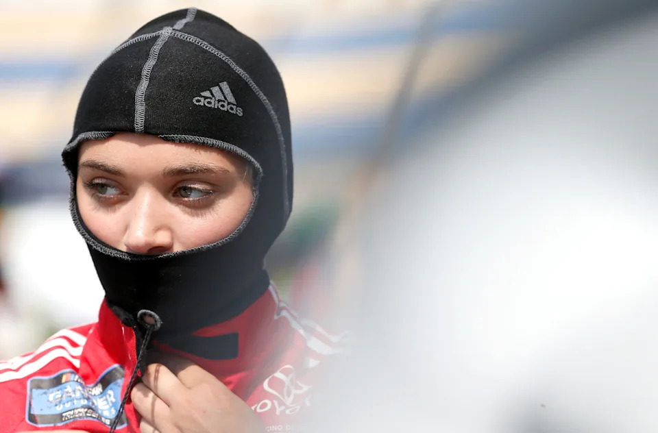 Natalie Decker, driver of the #54 N29 Technologies LLC Toyota, stands in the garage area during practice for the NASCAR Gander Outdoor Truck Series Buckle Up In Your Truck 225 at Kentucky Speedway on July 11, 2019 in Sparta, Kentucky.
