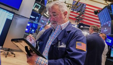 Tech carries Wall Street to records, even as most stocks fall after discouraging inflation data