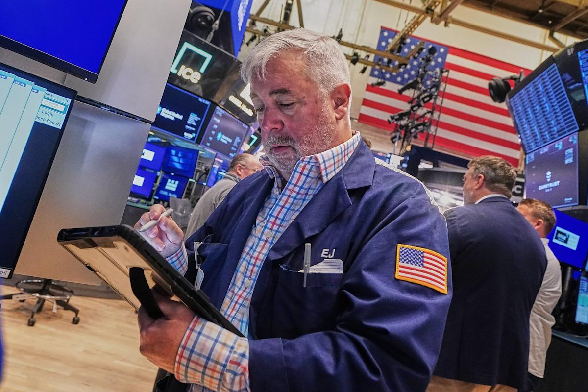 Tech carries Wall Street to records, even as most stocks fall after discouraging inflation data