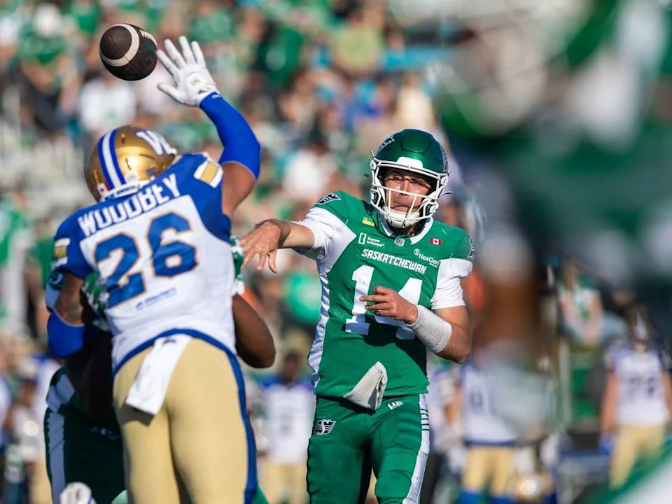 Saskatchewan Roughriders quarterback Jack Coan (14) throws the football against the Winnipeg Blue Bombers during the first half of CFL preseason football action at Griffiths Stadium in Saskatoon, Sask. on Saturday, May 23, 2026.