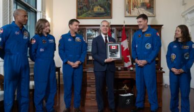 A coin and two special flags: PM Carney exchanges gifts with Artemis II crew - CTV News