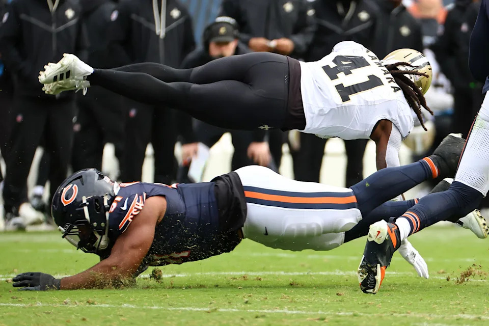 New Orleans Saints running back Alvin Kamara (41) dives for a first down against the Chicago Bears.