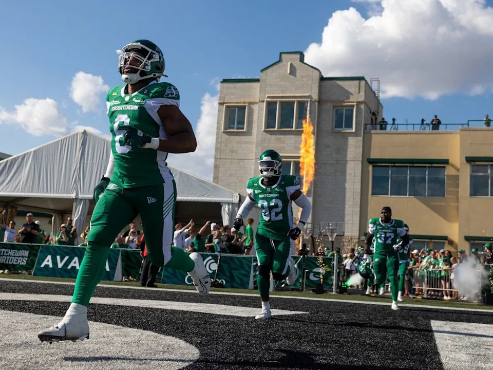 The Saskatchewan Roughriders enter the stadium before CFL pre-season football action against the Winnipeg Blue Bombers at Griffiths Stadium in Saskatoon, Sask. on Saturday, May 23, 2026.