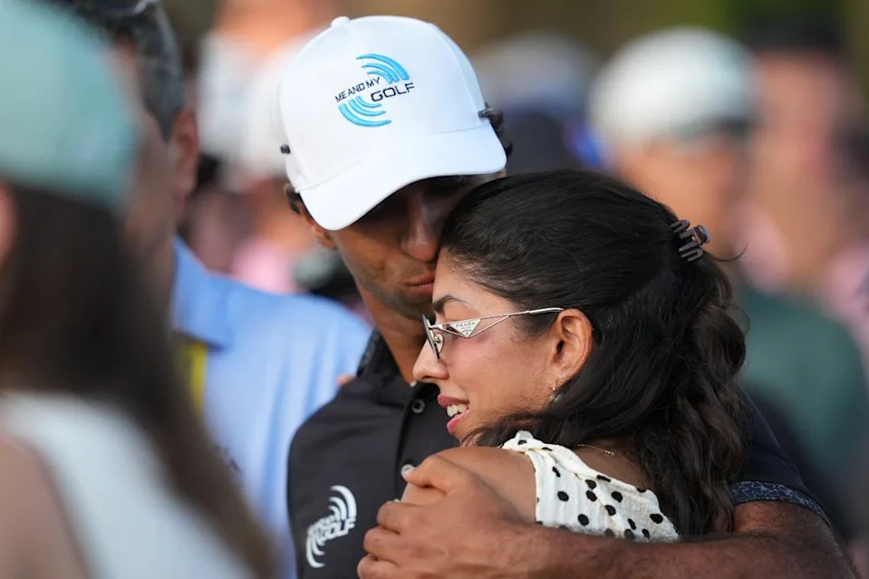 Aaron Rai reacts with his wife, Gaurika Bishnoi on the 18th hole during the final round of the PGA Championship golf tournament. James Lang-Imagn Images