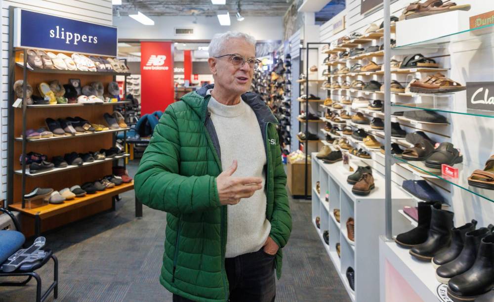 MIKE DEAL / FREE PRESS
Brian Scharfstein, owner of Canadian Footwear, says the DCSP is the best thing to come to downtown.