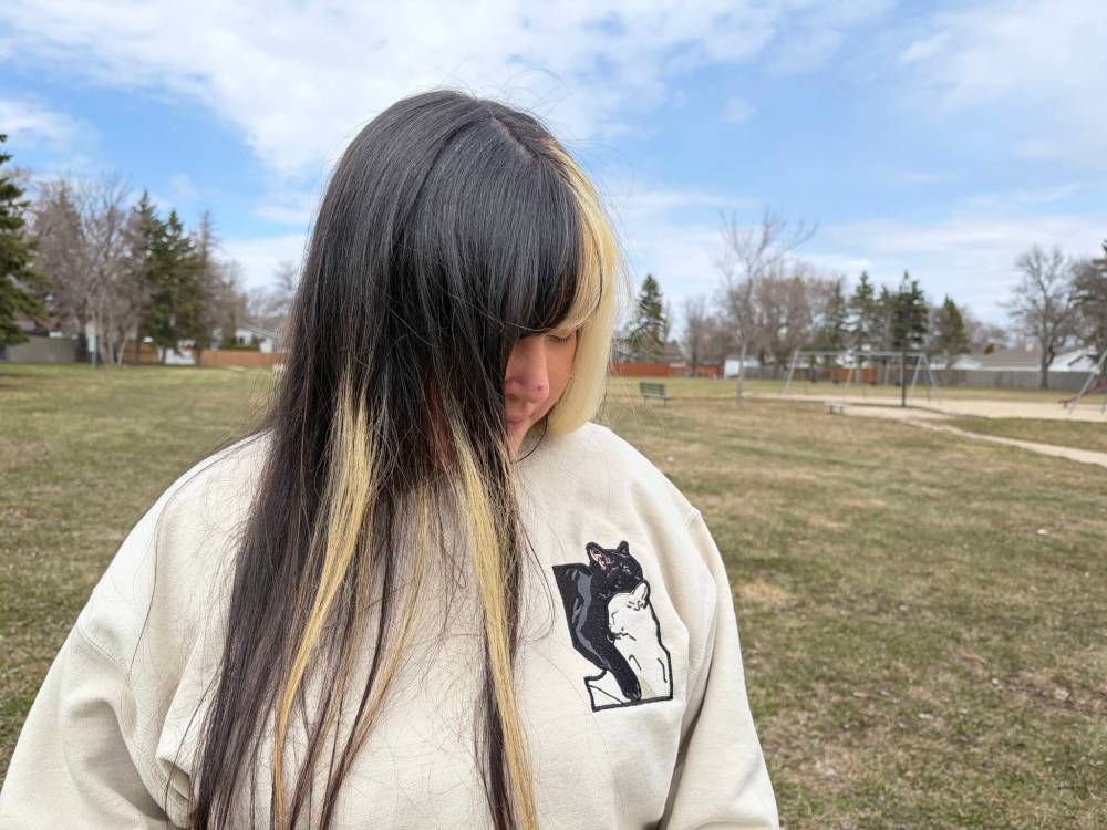 MAGGIE MACINTOSH/FREE PRESS
Rejeana McIvor, 30, said she gave two cats – Nami, who had black fur, and a white-haired feline named Nero — to a man accused of animal cruelty.