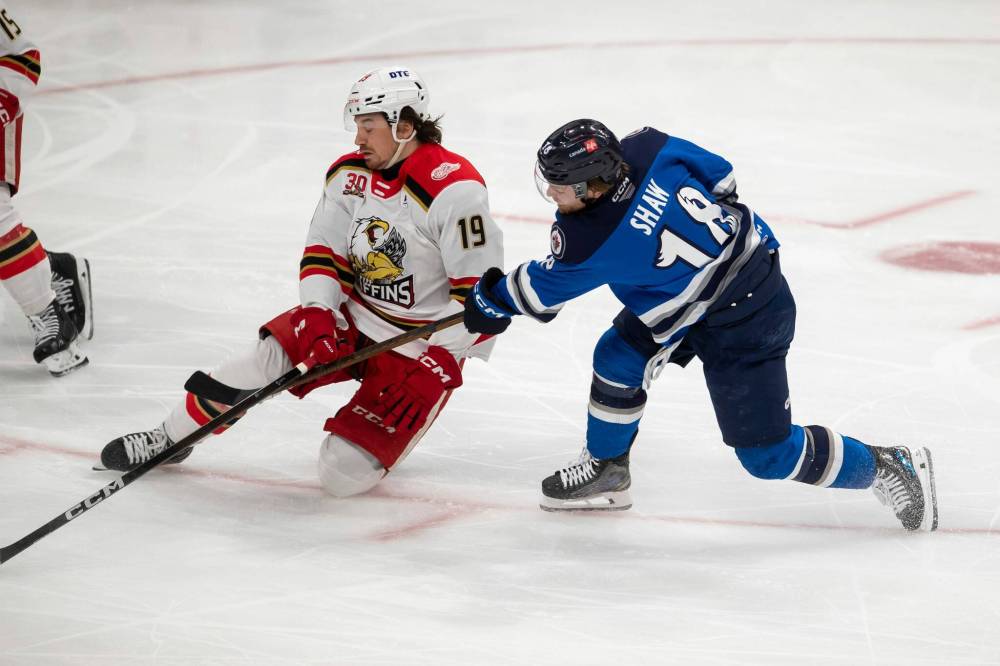 BROOK JONES / FREE PRESS
Manitoba captain Mason Shaw (right) is the only Moose to bulge the twine so far this series against the Grand Rapids Griffins. Shaw scored the game-winning goal on Saturday as the Moose took Game 1.