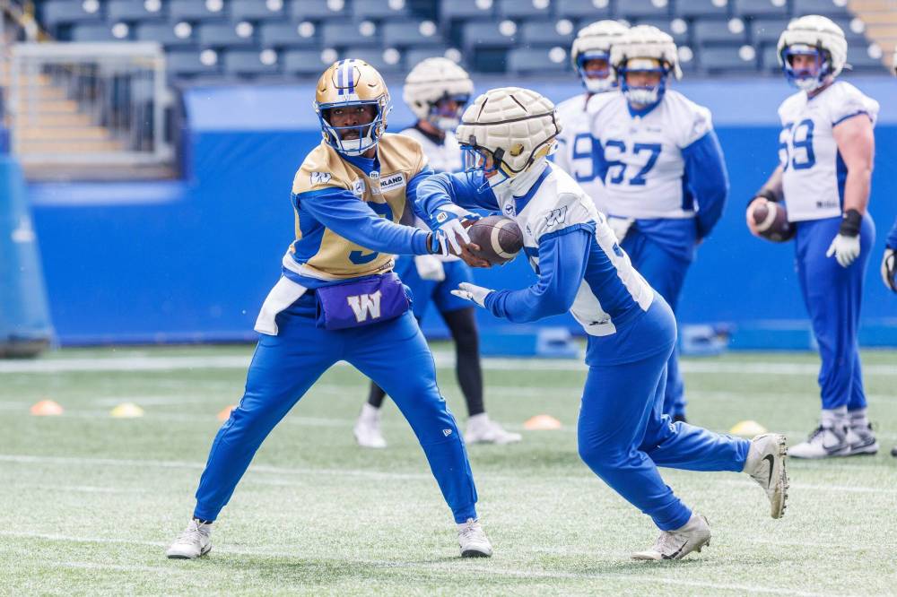 MIKE DEAL / FREE PRESS
Quarterback Bryce Perkins (left) has more than one connection with the Winnipeg Blue Bombers, including his father Bruce playing on the Hamilton Tiger-Cats when a young Mike O’Shea was breaking into the CFL with the club.