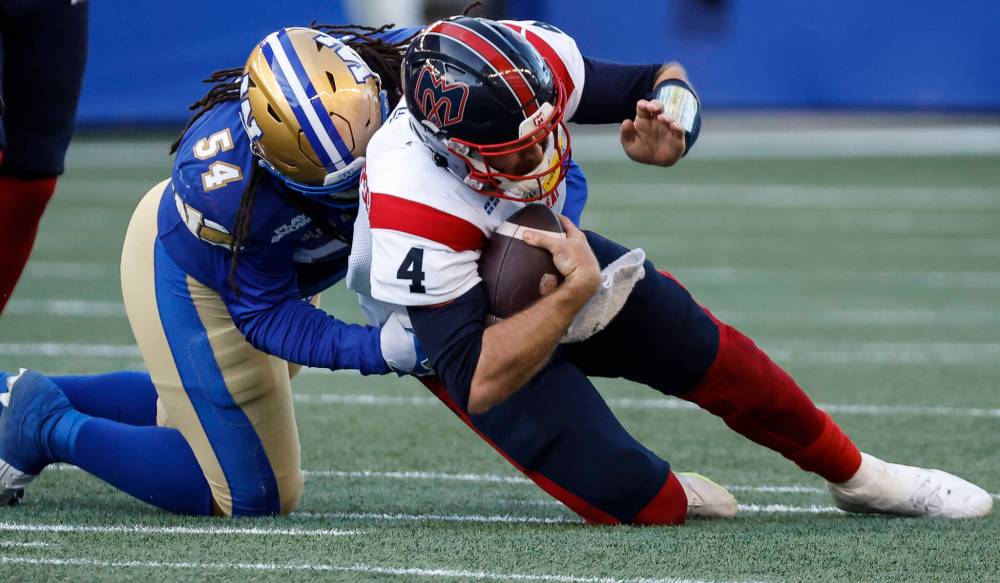 John Woods . THE CANADIAN PRESS FILES
Winnipeg Blue Bombers defensive lineman Kydran Jenkins sacks Montreal Alouettes quarterback McLeod Bethel-Thompson during CFL action in Winnipeg last October.