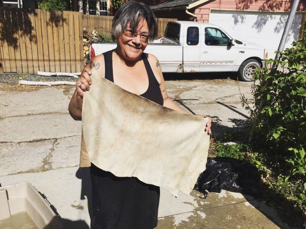 SUPPLIED
Audrey circa 2016-2018 tanning deer hides in her backyard.