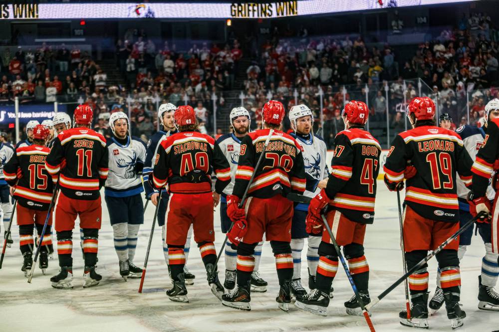 NICOLAS CARRILLO PHOTO
The gloves come off as the Manitoba Moose were eliminated from the Calder Cup playoffs by the Grand Rapids Griffins in Michigan on Friday.