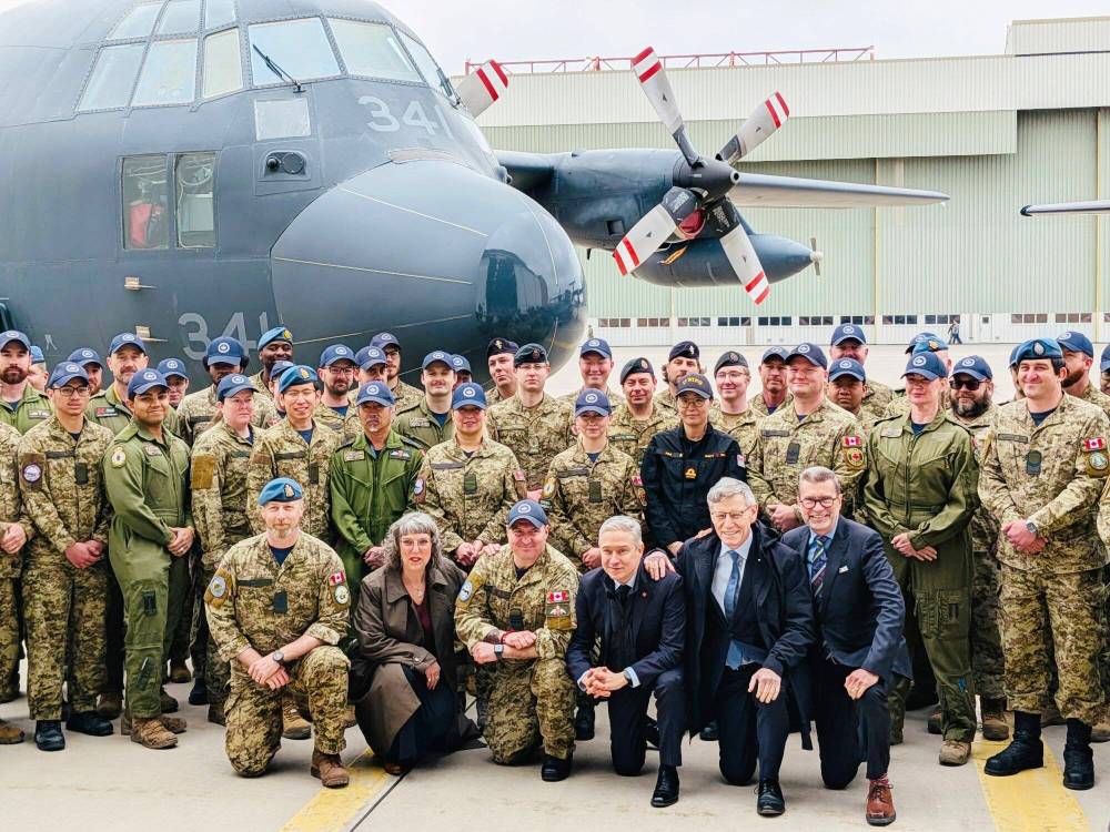 Supplied photo
Winnipeg West MP Doug Eyolfson (kneeling, far right) joined finance minister François-Philippe Champagne (third from right, ) Winnipeg South MP Terry Duguid (second from right), Saint Boniface – Saint Vital MP Ginette Lavack, (second from left) and members of the Royal Canadian Air Force at a recent defence announcement at 17 Wing Winnipeg related to the government’s spring economic update.