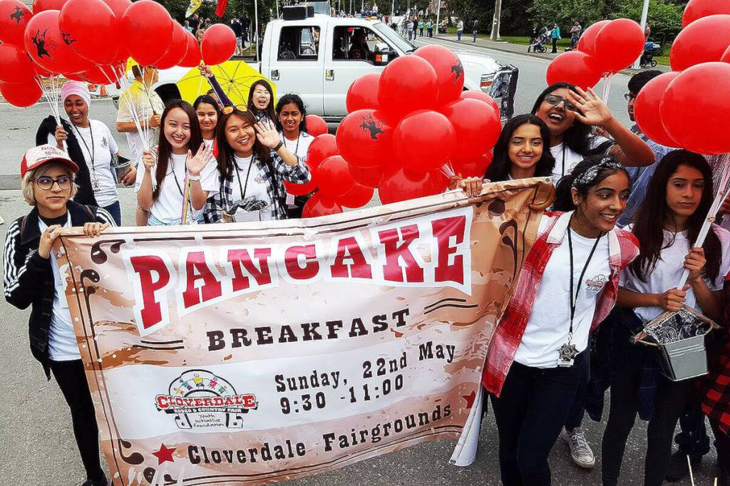 Volunteers with the Cloverdale Rodeo Youth Initiative Foundation advertise for their pancake breakfast, a fundraiser for the foundation. (Photo submitted)