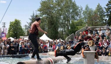 A log-roller is about to hit the drink during a West Coast Lumberjack Show competition at a previous Cloverdale Country Fair. The ever-popular lumberjack show is back for the 2026 fair. (Photo: Jason Sveinson)