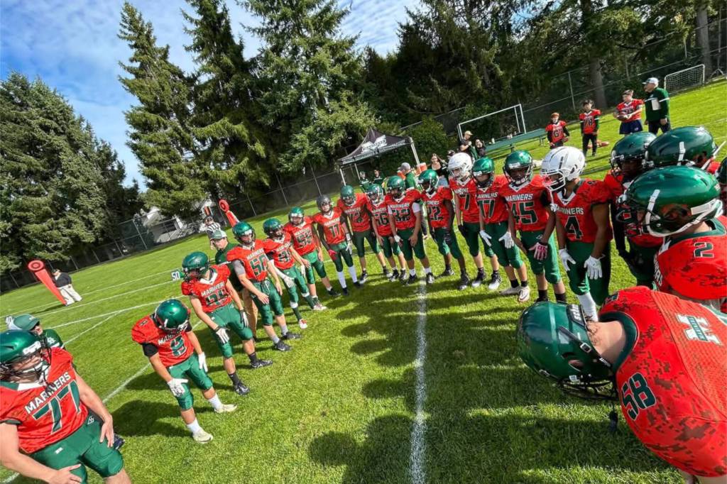South Surrey&rsquo;s Earl Marriott Secondary School&rsquo;s football team circle up before a game in 2024. The Mariners are in need of a new head coach as soon as possible. (Melody Cook photo/Contributed to Peace Arch News)