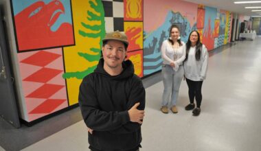 Artist Josh Conrad, seen here with Indigenous support workers Caitlin Demmitt and Kristie Peters, painted this mural inside Shxwelis te Ts&rsquo;qó:ls (Spirit of Hope Secondary School). They are pictured on April 10, 2026. (Jenna Hauck/ Hope Standard)
