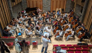 Violin soloist Cameron Wilson rehearses Suite Francaise – a tribute to three famed French jazz violinists – with String Studies director Carla Birston and the Sinfonietta ensemble at the VSO School in Vancouver. (Contributed to Peace Arch News))