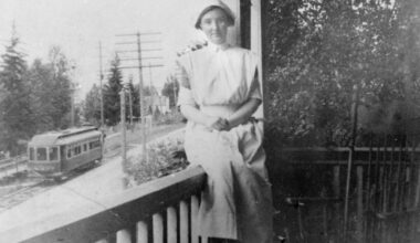Unknown nurse on the verandah of the Home Hospital (1902–1909), overlooking the streetcar route on Front Street. This could be a photo of Ella DesBrisay, Ethel Ferris, or Ira Morris. DesBrisay and Ferris opened the Home Hospital on July 31, 1902, and several years later Ira Morris joined DesBrisay in running the hospital after Ethel Ferris&rsquo;s marriage. (Nelson Museum, Archives and Gallery)