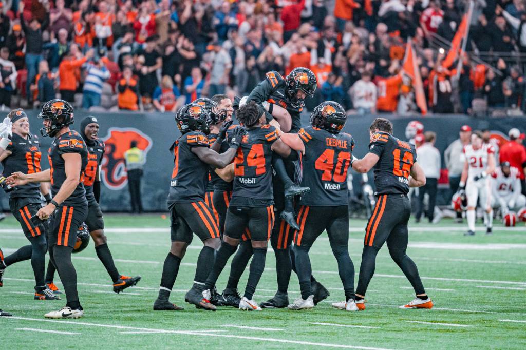 BC Lions players celebrate a playoff win at BC Place Stadium in Vancouver in November 2025. (Jaclyn McKee/BC Lions photo)