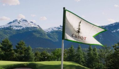 A flag waves in the wind at Cabot Revelstoke, a luxury 18-hole golf course opening alongside Revelstoke Mountain Resort in 2027 after preview play this fall. (Photo courtesy Cabot Revelstoke)