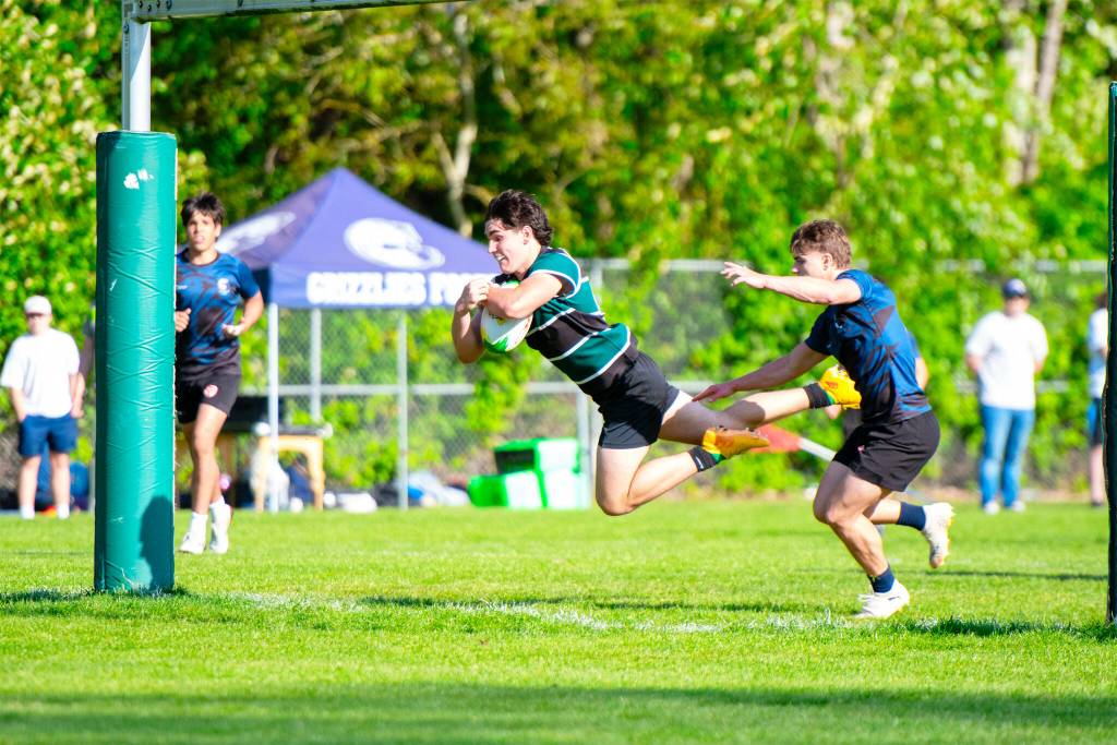 Caine Maggio, 8-man for the Lord Tweedsmuir senior boys rugby team, flies across the tryline for one of his four tries on the day in a game against GW Graham May 1. Tweedy won the match 61-7. (Brooklynne Stephens photo/ submitted to the Cloverdale Reporter)