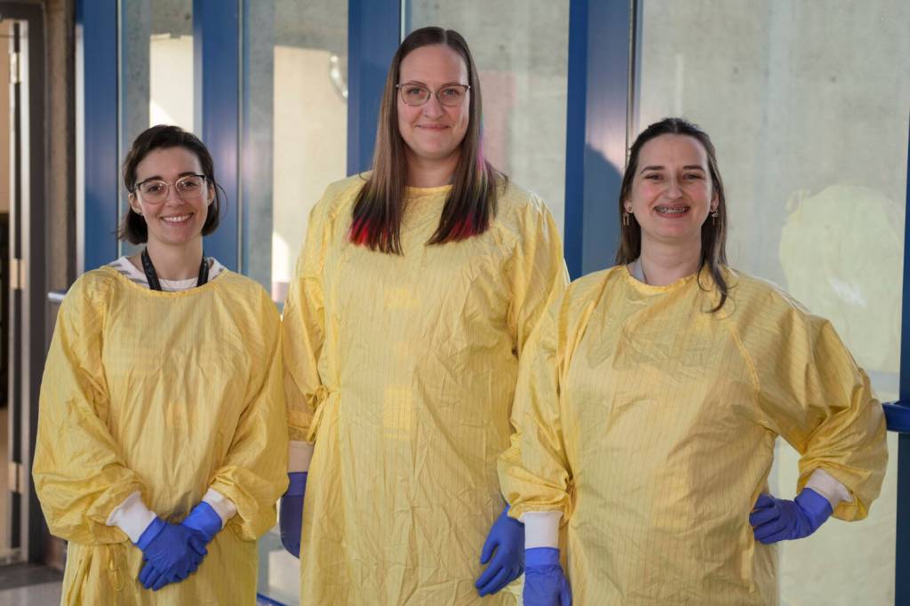 Speech therapist Meaghan Delaney (left) registered nurse Sara Baynes, and speech therapist Marie Shuman are shown wearing reusable isolation gowns. The introduction of reusable gowns has allowed the RJH Renal Unit to eliminate the 30,000 disposable plastic gowns it went through annually. (Courtesy of Island Health)