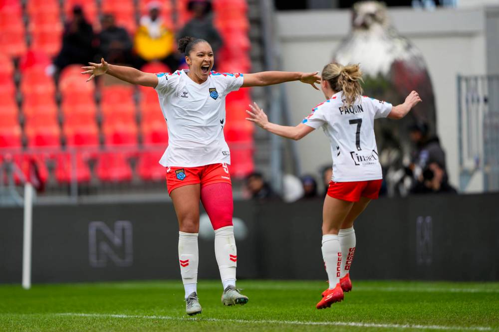 KEVIN SOUSA / NSL
Montreal’s Noémi Paquin (right) celebrates teammate Elyse Bennett’s (left) goal Sunday against AFC Toronto. Bennett has had a goal a game so far — including two in the season opener — for the Roses.