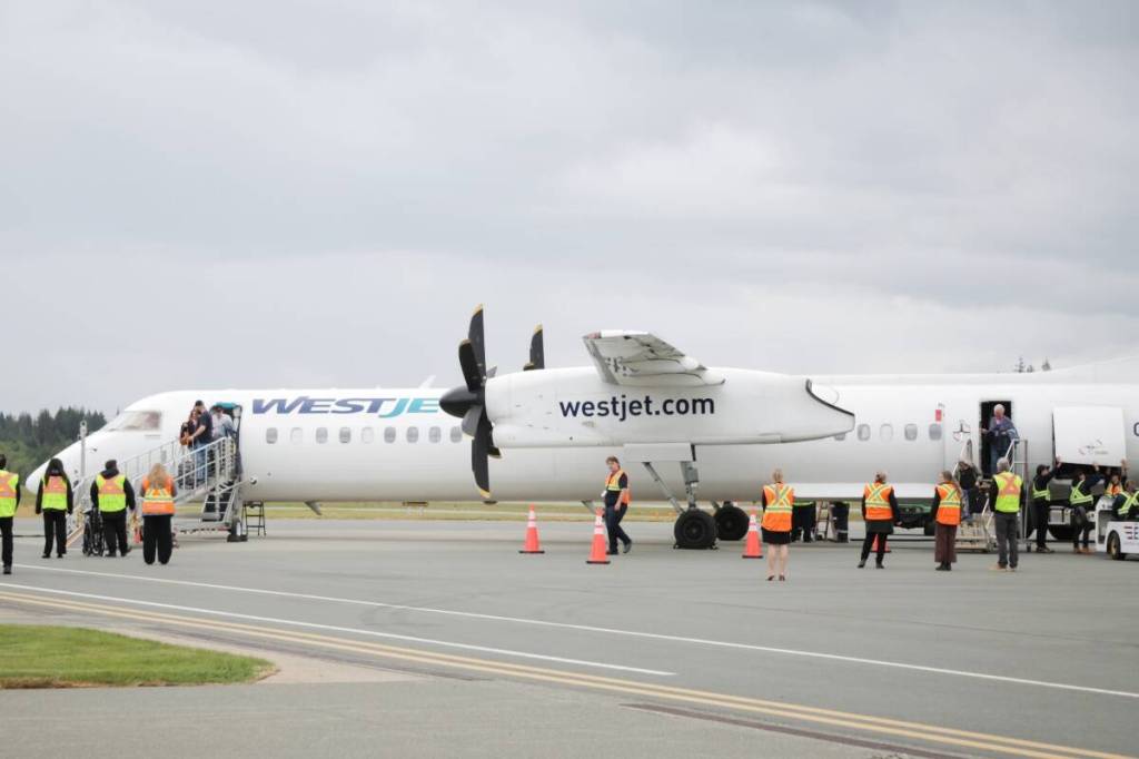 Passengers disembark the first nonstop flight from Calgary to Campbell River on May 15. (Robin Grant/Campbell River Mirror)
