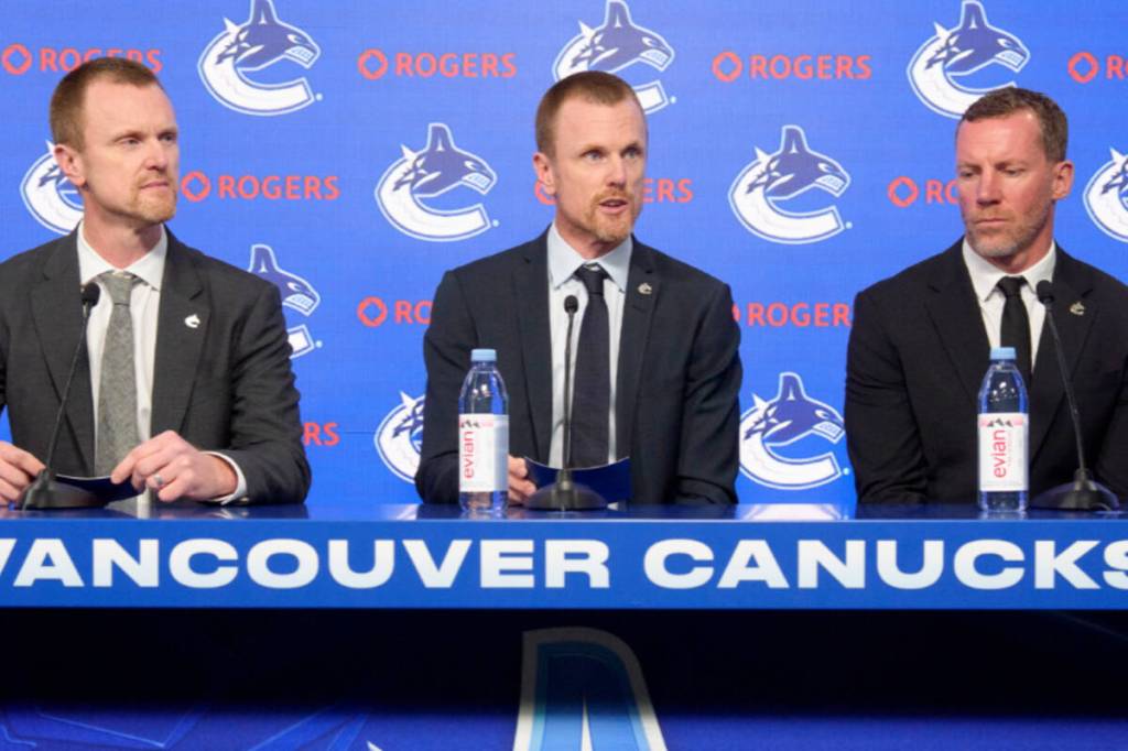 The Vancouver Canucks new management team of Daniel and Henrik Sedin and Ryan Johnson are introduced at a press conference Thursday at Rogers Arena. (Vancouver Canucks)