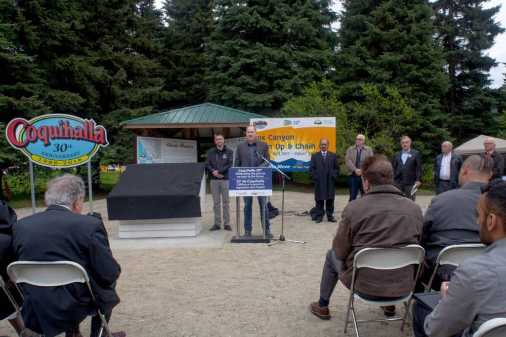 Michael Jacobs (centre) spoke at the ceremony celebration for the 30th anniversary of the Coquihalla being built. (B.C. Government)
