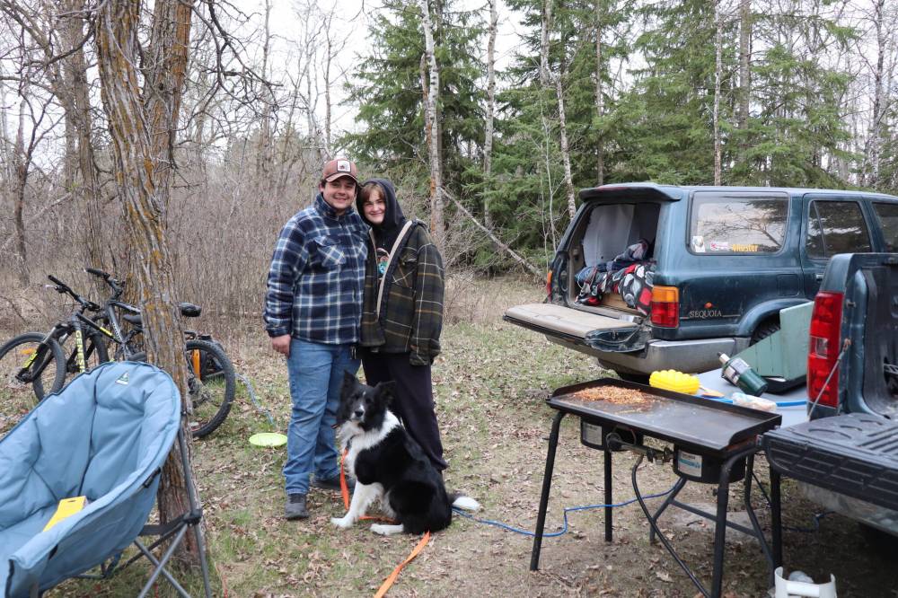 TYLER SEARLE / FREE PRESS
Davis Smith (left) Ella Fontaine and their dog, Weston had a comfortable sleep inside the SUV they retrofitted for back-woods camping, despite the chilly weather.
