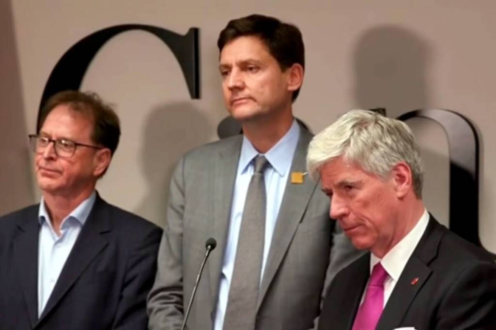 From left: B.C. Energy Minister Adrian Dix, B.C. Premier David Eby and federal Energy Minister Tim Hodgson during a joint announcement in Vancouver on Kitimat's LNG Phase 2 project on May 14, 2026 (B.C. Government YouTube/screenshot)