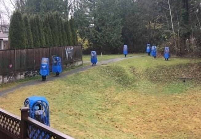 Protesters walked around Guildford neighbourhood in blue bubble suits. (Surrey Now-Leader file photo)
