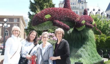 Cousins Gail Hunter, Laurie Hugill, Melody Eldreth and Julie Caldie, visiting from the U.S. and Calgary, stop for a snap next to the orca topiary sculpture before high tea at the Fairmont. (Ben Fenlon/Victoria News)