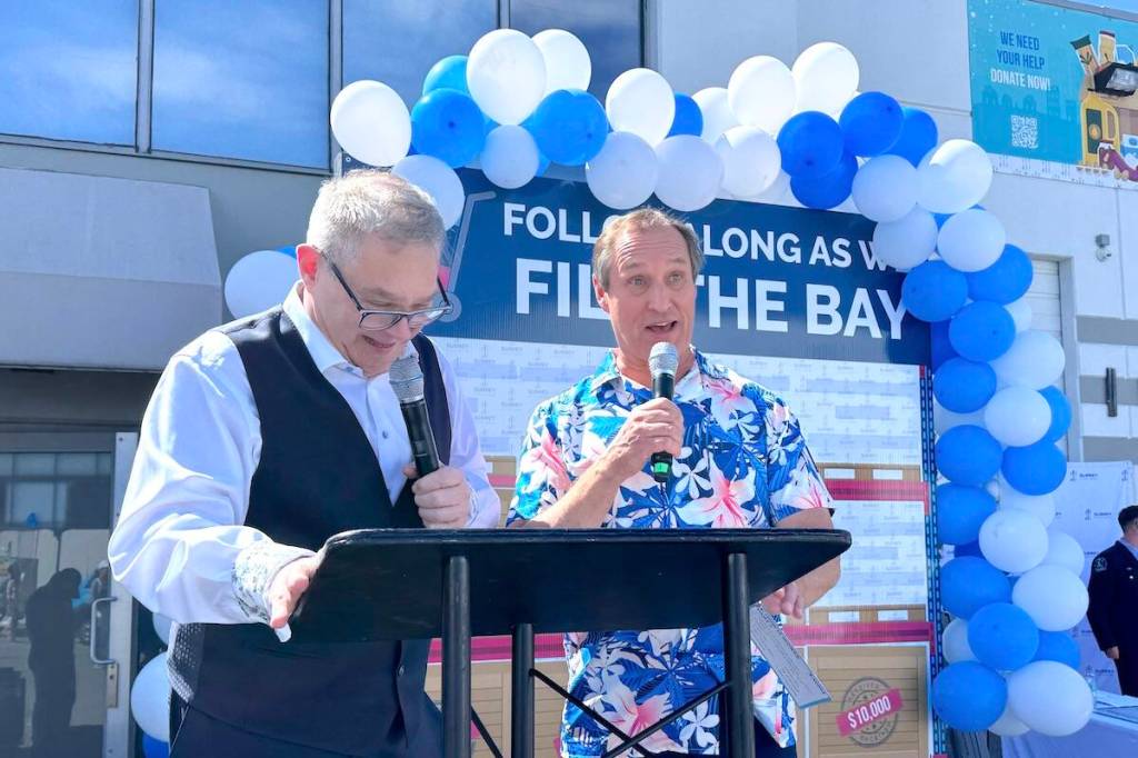Fill the Bay event co-hosts Howard Blank, left, and Mark Madryga at Surrey Food Bank&rsquo;s warehouse in Newton on Thursday, May 21, 2026. (Tom Zillich/Surrey Now-Leader)