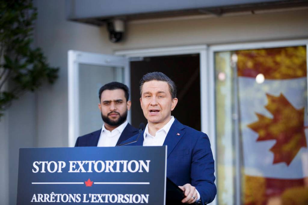 Pierre Poilievre, right, and MP for Abbotsford-South Langley Sukhman Gill speaking at a press conference outside Nirwan Flooring in Surrey on Friday, May 22, 2026. (Anna Burns/ Surrey Now-Leader)