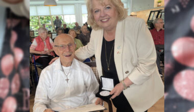 Surrey Mayor Brenda Locke presents Stan, 100, with a Key to Surrey achievement medal and certificate from King Charles III during an event at Whitecliff Retirement Residence celebrating six centenarians as &lsquo;Legends Among Us.&rsquo; (Contributed to Peace Arch News)