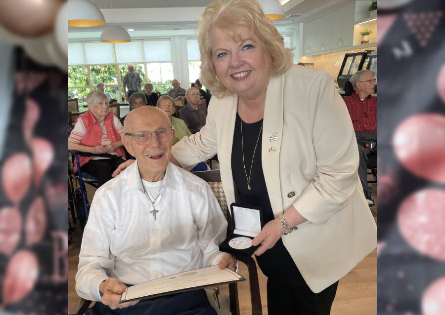 Surrey Mayor Brenda Locke presents Stan, 100, with a Key to Surrey achievement medal and certificate from King Charles III during an event at Whitecliff Retirement Residence celebrating six centenarians as &lsquo;Legends Among Us.&rsquo; (Contributed to Peace Arch News)