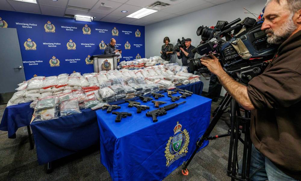 MIKE DEAL / FREE PRESS
Winnipeg police display drugs and guns seized during Project Puma, which led to the arrest of 33 people accused of drug trafficking and other crimes. Several of the accused were already known to police.