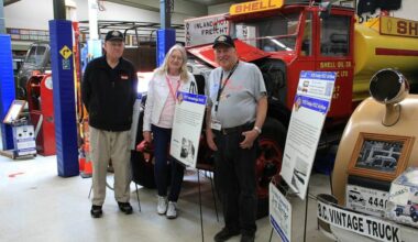Anna Dean, president of the B.C. Vintage Truck Museum, stands between volunteers Noel Cleveland (left) and Gord Hallam during the truck show in 2025. The museum is hosting its annual truck show July 11. (Photo: Malin Jordan/Cloverdale Reporter)