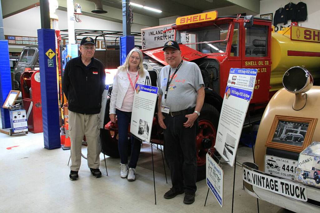 Anna Dean, president of the B.C. Vintage Truck Museum, stands between volunteers Noel Cleveland (left) and Gord Hallam during the truck show in 2025. The museum is hosting its annual truck show July 11. (Photo: Malin Jordan/Cloverdale Reporter)