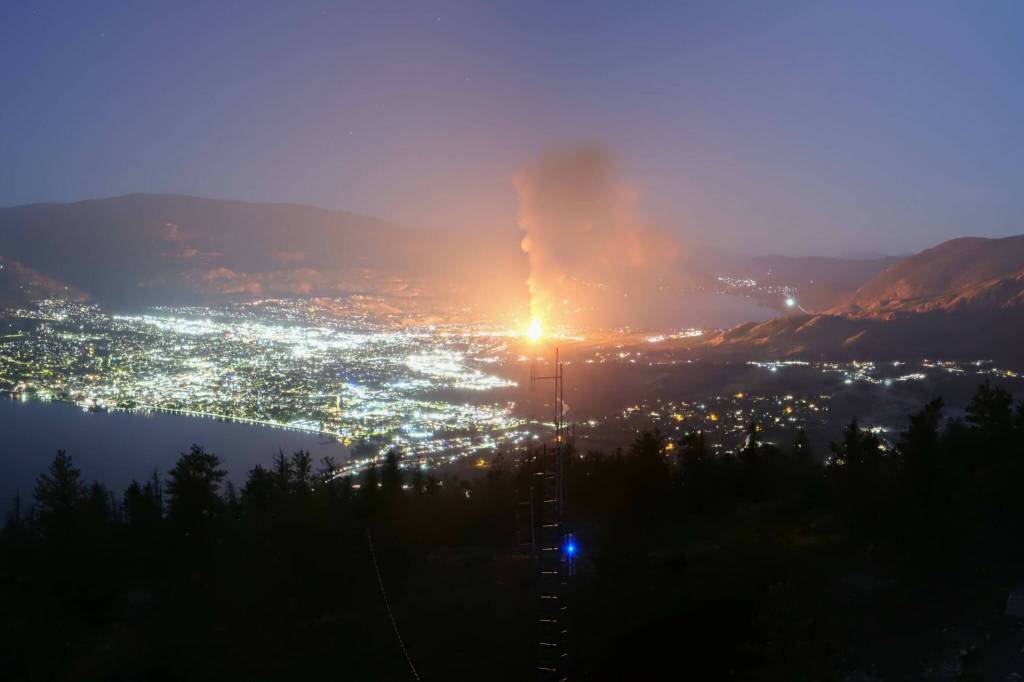 The construction site for a long-term care facility in Penticton erupted into flame late on May 27, with flames visible across Skaha Lake. Highway 97 remained closed near the scene on May 28. (City of Penticton webcam)
