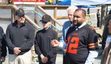 Minister of Forests Ravi Parmar speaks at the BC Lions announcement May 30, with Lions senior vice-president of business George Chayka, and Coulson Group CEO Wayne Coulson with his grandson Baron. (Ben Fenlon/Goldstream Gazette)