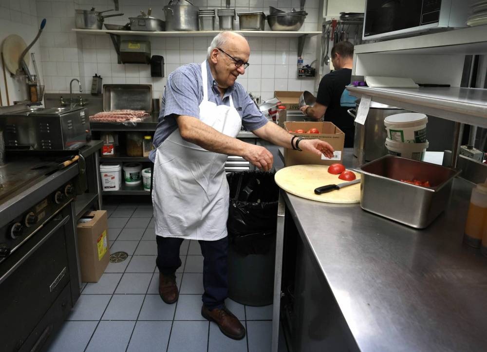 RUTH BONNEVILLE / FREE PRESS
After 30 years serving their community at 3318 Roblin Blvd., Bob and Maria Papasotiria, owners of Pappas Greek Food and Steak are retiring and closing their restaurant. On Friday, Bob was preparing one of the restaurant's last orders.