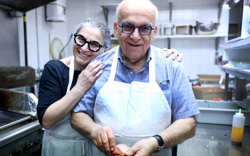 RUTH BONNEVILLE / FREE PRESS
Sharing a quick embrace on their last day in business at Pappas Greek Food and Steak, Bob and Maria Papasotiriou, who have been serving the community for 30 years at 3318 Roblin Blvd. are retiring and closing their restaurant.