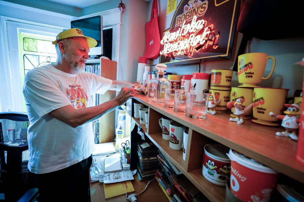 JOHN WOODS / FREE PRESS
Ronald George Moore, 56, has been collecting Robin's Donuts paraphernalia for 15 years.