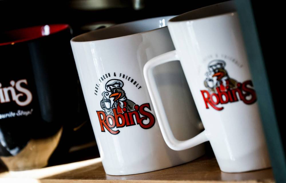 JOHN WOODS / FREE PRESS
Moore's collection started with a travel coffee mug.